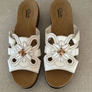 Clarks white leather upper slide sandals. New without a box.